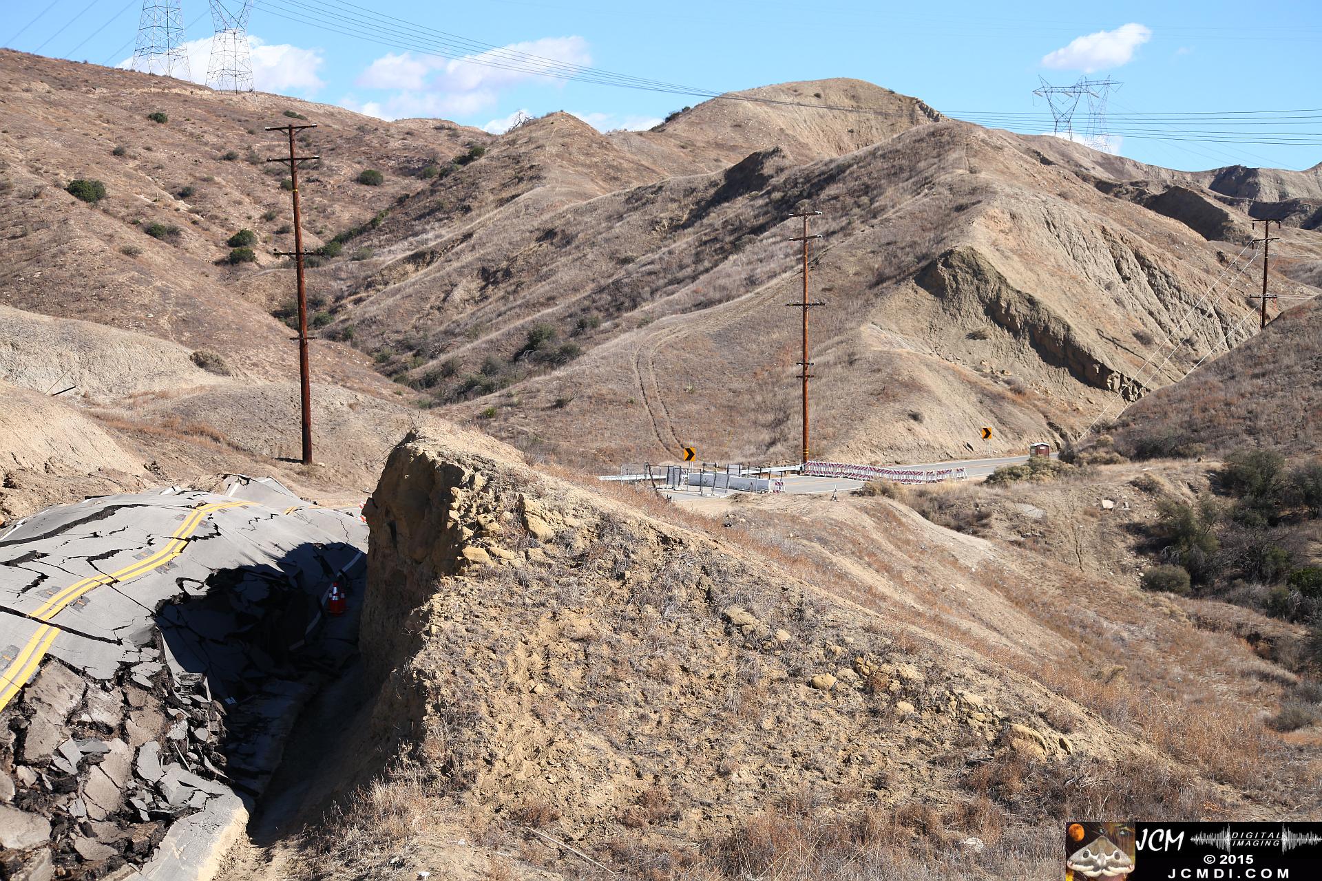 Landslide, buckled pavement, and terrain at Vasquez Canyon Road in Santa Clarita, CA filmed 11-25-2015